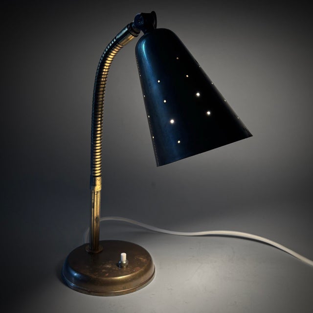 A decorative Scandinavian modernist table lamp, produced by an unidentified Danish manufacturer in the 1940s. The lamp is...