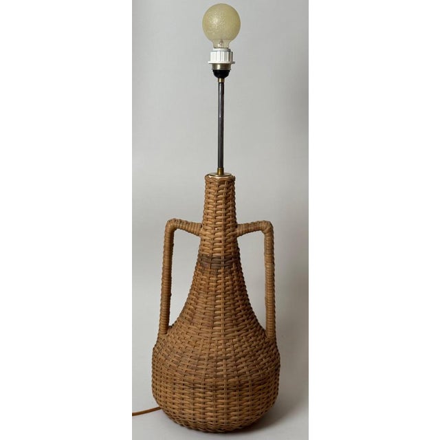 This extraordinary floor lamp features a design that is emblematic of boho and mid-century styles. Its ceramic body has...