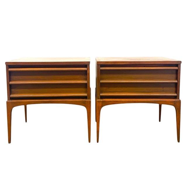 Offered is a pair of Mid-Century Modern end tables by Lane Furniture of Altavista, Virginia. Each table is crafted in...