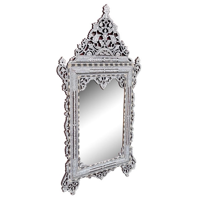 This elegant white mother-of-pearl inlaid mirror is a remarkable example of traditional craftsmanship from Damascus,...