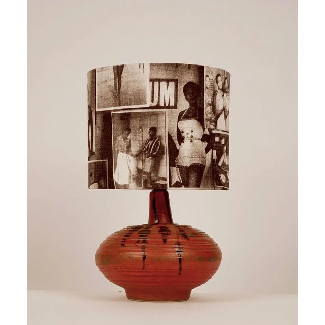 The lamp base comes from the Hungarian studio ceramic era, 1950s. The hand formed ceramic is glassed orange with dark...