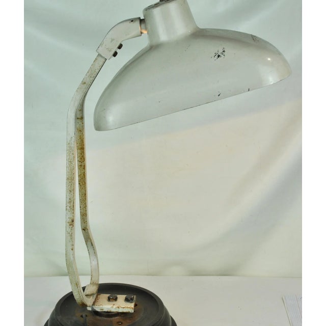 This lamp was part of Kodak's copier and has had an industrial base added to it for maintenance, it has a slightly crooked...