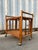 Vintage Boho Chic / Coastal Style Rattan Dry Bar/ Serving Cart in the Franco Albini's Manner. Circa 1970s Features a two-...