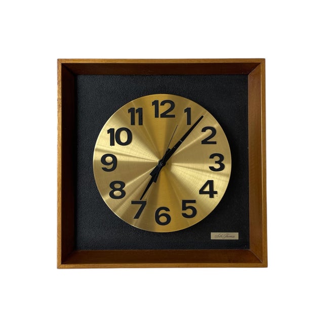This vintage wall clock by Seth Thomas exemplifies the clean, sculptural aesthetic of mid-century modern design. Known as...