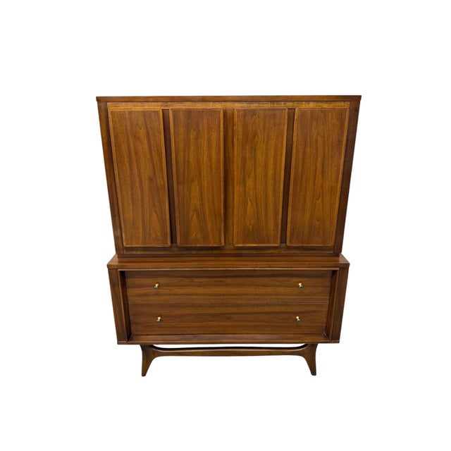 An exceptional example of American Mid-Century Modern craftsmanship! This stunning 4-piece walnut bedroom set by Kent...
