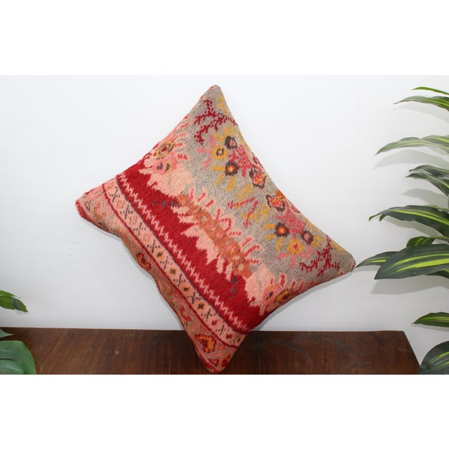 This Turkish pillow cover is made from the highest quality antique rug in 100% wool on the front. The back is covered in...