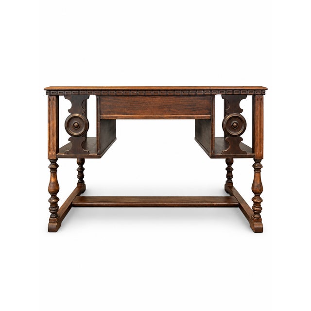 A handsome early-20th-century library table or writing desk by Maddox Tables of Jamestown, New York. The original “Mad-Ox”...