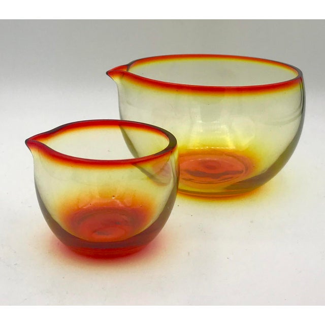 These small hand blown spouted bowls of Amberina are as stunning as they are rare. One holds exactly 1/2 cup of fluids the...