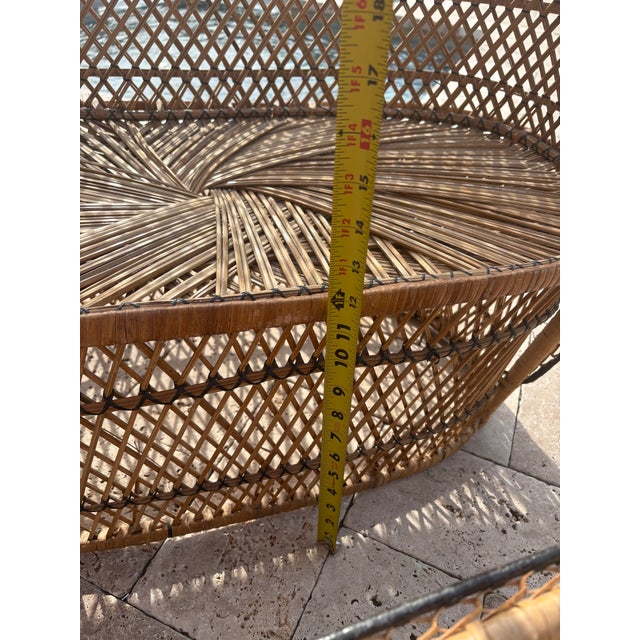 Charming vintage child-size rattan loveseat paired with a matching oval coffee table, featuring beautifully handwoven...