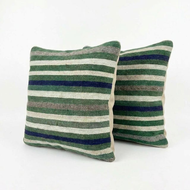 This beautiful 24'' x 24'' pillow cover set was made from authentic Turkish rug pieces. Bright colors of wool adorn the...