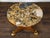 A French Napoléon III period mahogany center table from the mid 19th century with colorful marble top, pedestal base and...