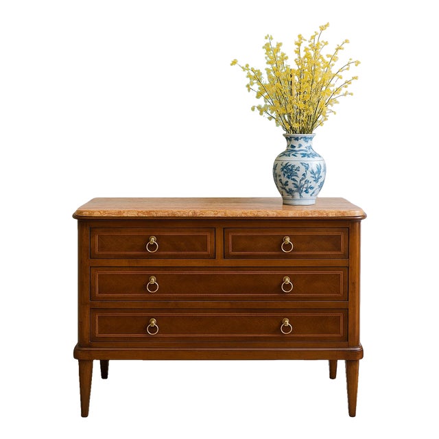 This Italian Neoclassical marble-top commode is a gorgeous blend of symmetry, craftsmanship, and timeless European style....