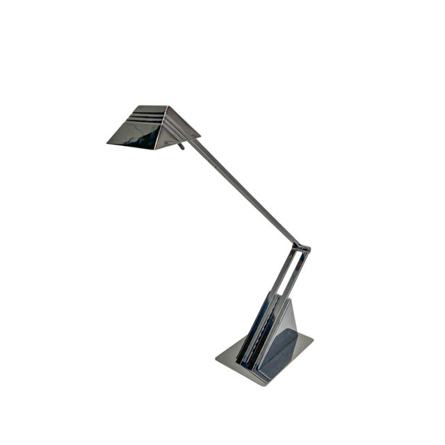 A particularly expressive desk lamp by hillebrand leuchten germany from the 1980s. it is made of polished metal and...