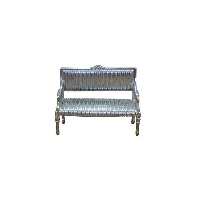 Vintage silver dollhouse miniatures set. Features a table, two chairs and a settee loveseat. Marked on base. Dimensions:...