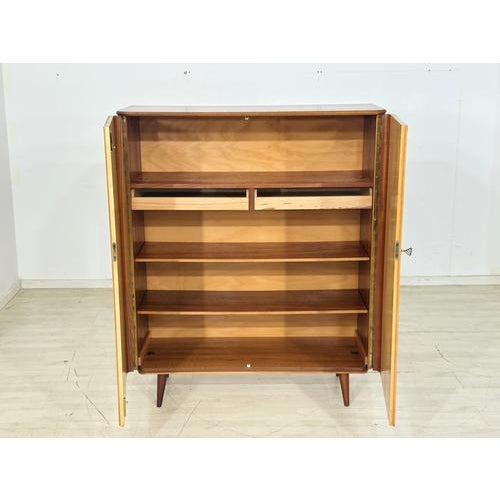 Beautiful vintage cabinet in very good condition. Wood: Birch/Makore, 1960s. Good condition. Key included. Dimensions:...