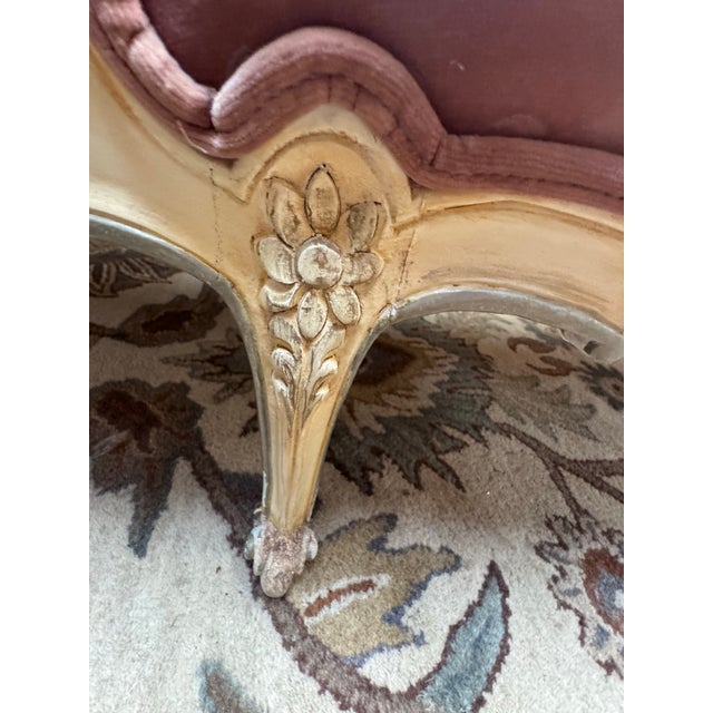 A beautifully carved French Provincial style chaise lounge upholstered in a soft dusty rose velvet. This elegant chaise...