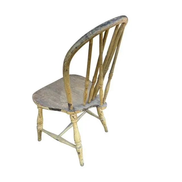 An early 1900s rustic spindle back chair in mustard green — a characterful accent for a country home. Lovely as a desk...