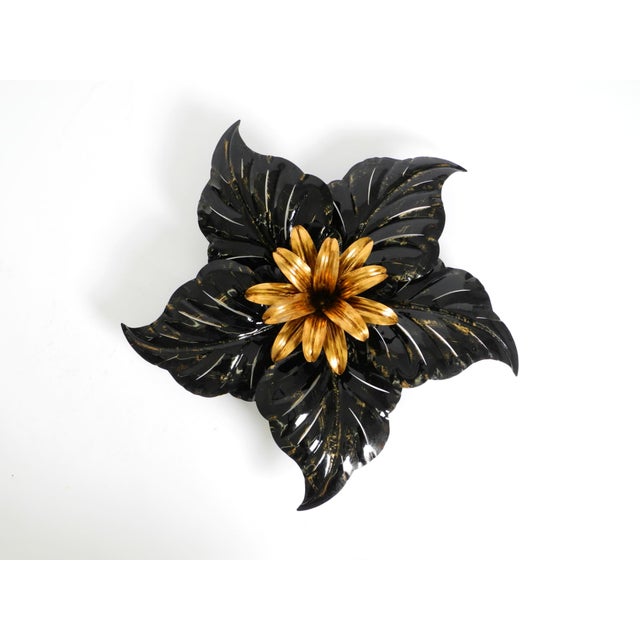 Hans Kögl was a renowned lighting and table designer. He worked with natural forms such as palm leaves and other plant...