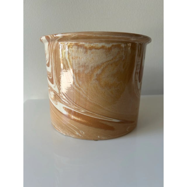 Mid century, ceramic swirl vase, finished with a high gloss glaze, camel and ivory colors. My hypotheses is this is coined...