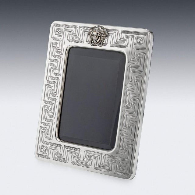 A beautifully crafted 20th century gianni versace solid silver and gold-plated picture frame, complete with its original...