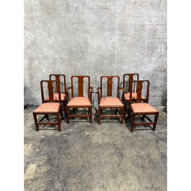 Elegant late 19th century George II style dining chairs, offered as a set of six, including two armchairs and four side...