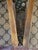 Charming pair of vintage wooden ladder‑back chairs with curved back slats, warm natural wood, and hand‑woven rush seats....