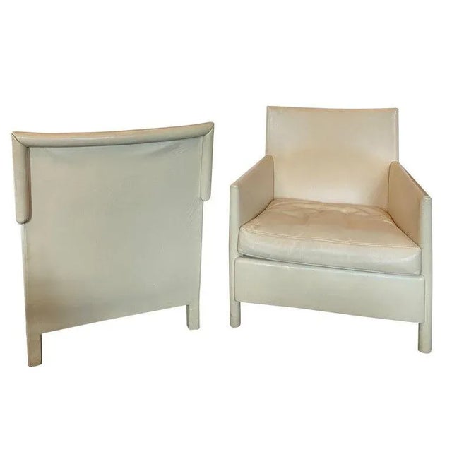 Pair of exceptionally comfortable lounge chairs in leather that is cream, ivory or light khaki in color. Lovely shape with...