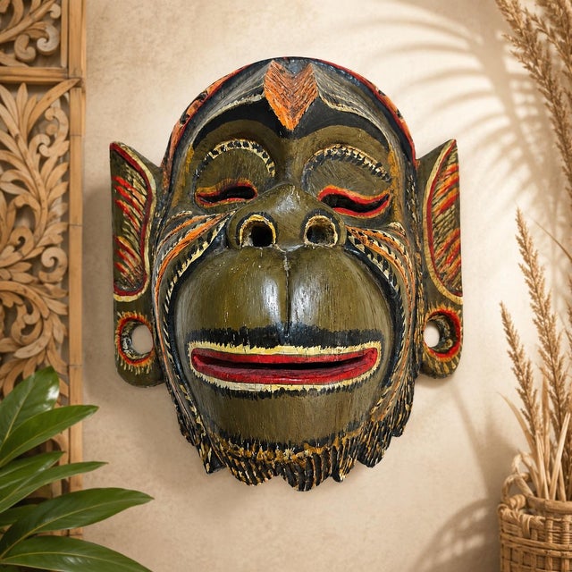A wonderfully expressive vintage Balinese monkey wall mask, hand carved in wood and finished by hand in warm natural tones...