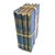 Antique book bundle in beautiful blue tones. Various old books with aged leather and cloth bound covers wrapped in thin...