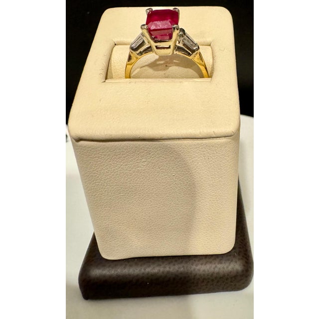 2.5 Ct Emerald Cut Treated Ruby & 0.15 ct Diamond Ring 14 Kt White Gold Size 5 Introducing a truly stunning piece, behold...