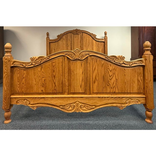Beautiful Oakwood Interiors solid wood bed, proudly made in America, featuring a rich warm amber-toned oak finish—a more...