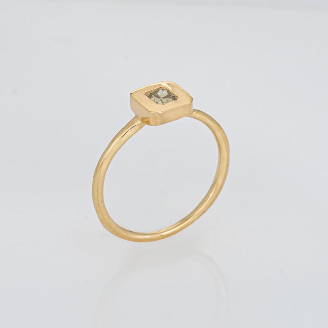 Stylish contemporary fancy colored diamond band crafted in 14 karat yellow gold. Fancy colored square shaped brown-light...