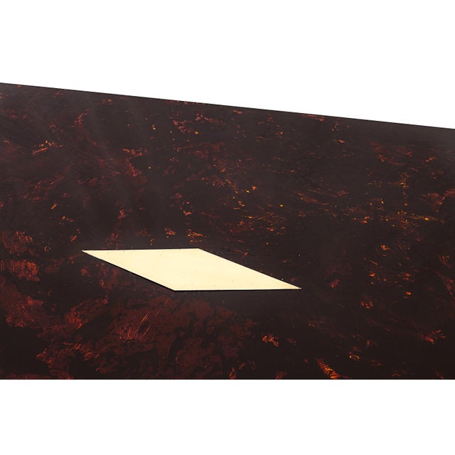 Coffee table by Eric Maville. “Tortoiseshell” lacquered brass plate tray. Golden field wand. Brass central plate. Circa...