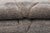 Understated lines, quietly drawn. Faint diamond-forming lines trace across a richly textured field of cool gray and deep...