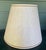 Pair of cream boucle/tweed style material lamp shades with brown trim. Based on the lamps I found these on, I'm guessing...