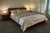 Dania Wood California King Sleigh Bed. This distinctive Scandinavian-style platform frame is crafted with a curved cherry...