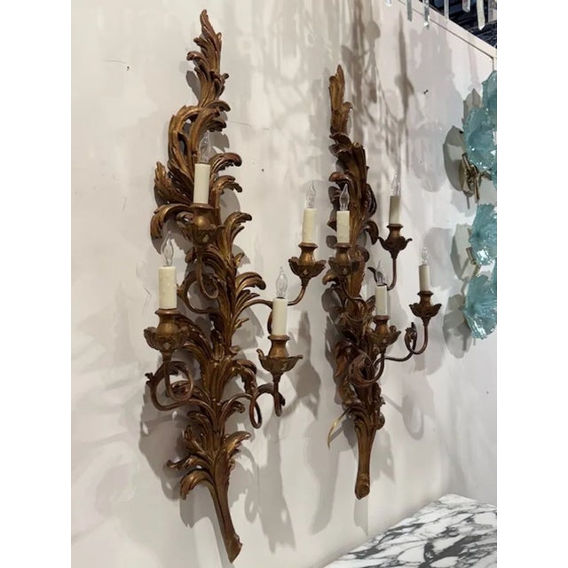 These large Antique Italian Giltwood and Iron Sconces are a stunning addition to any home décor. The elegant combination...