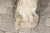 A French vintage stone dog sculpture with weathered appearance from the first half of the 20th century. This charming...