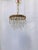 Italian upside down layered chandelier with bronze rim and 30% leaded unique almond cut crystal drops. Restored, rewired...