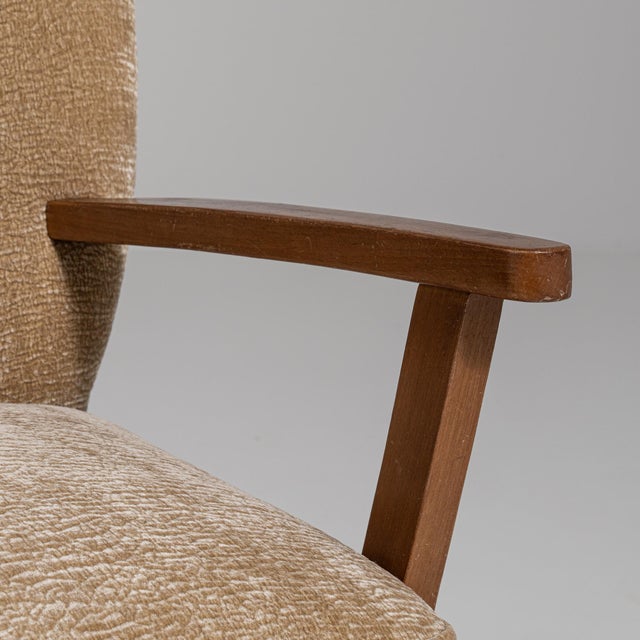 A cream wood, Mid-Century Modern-style armchair, dating to the 1940s and made in Denmark. The wood frame is finished in...