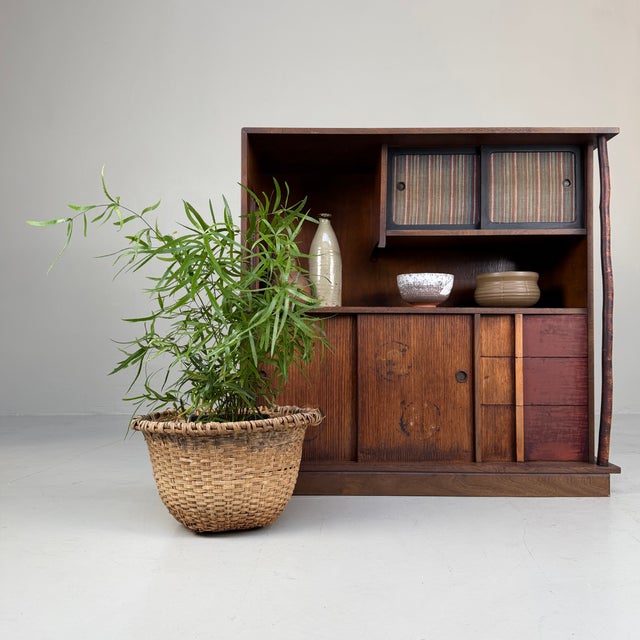 A distinctive Japanese cabinet from around 1920, with a playful and thoughtfully composed layout that gives the piece its...