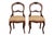 A pair of Eastlake period, American made, balloon back chairs. Petite frames are made of cherrywood, with balloon shaped...