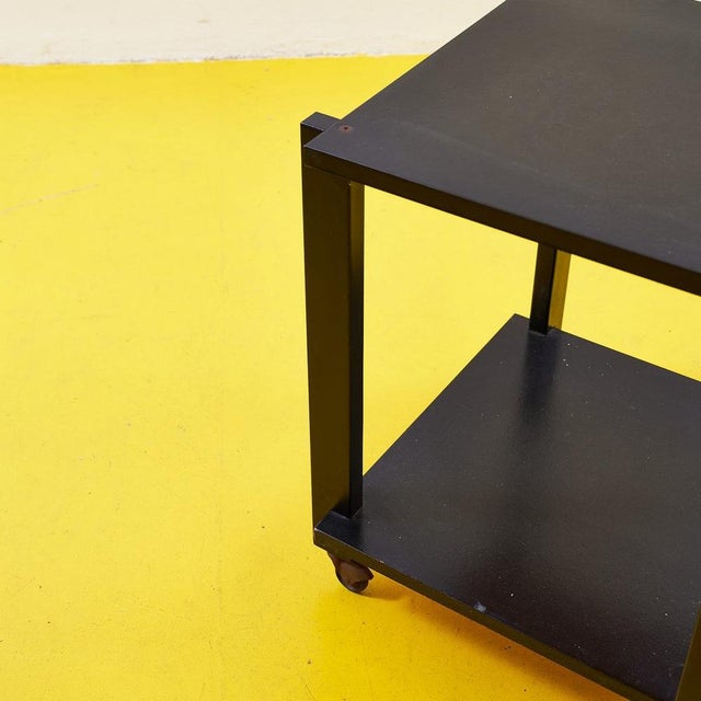 This elegant black metal cart is ideal for those seeking a functional and contemporary design piece. Featuring clean lines...