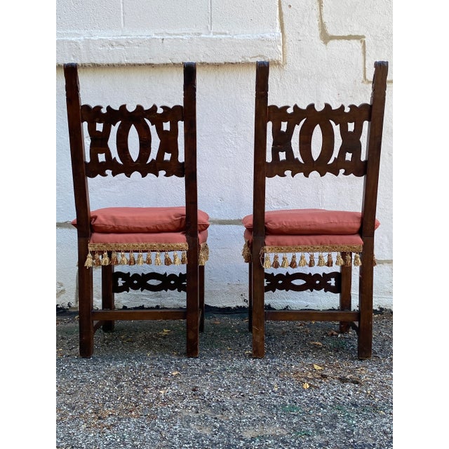 Elaborate Antique Italian wood chairs with tassel cushions. Beautiful and quite rare. In good used antique condition.
