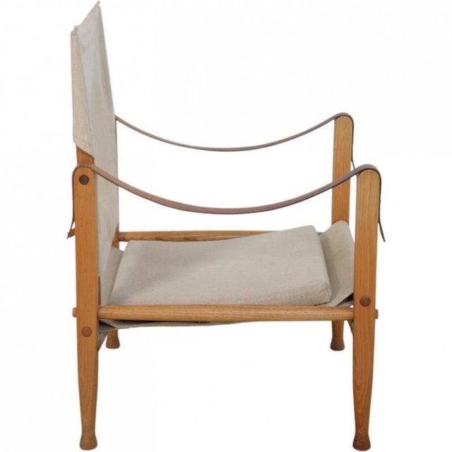 Kaare Klint Safari chair upholstered in canvas fabric and with a frame of ash. The chair is from the 1980s but was later...