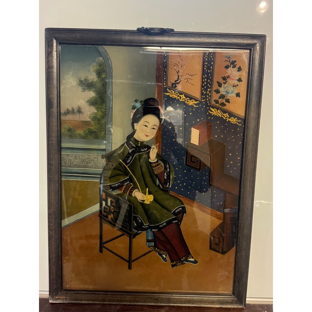 An exceptional, museum-quality Chinese reverse glass painting (buxiang) depicting an elegant court beauty (meiren). This...
