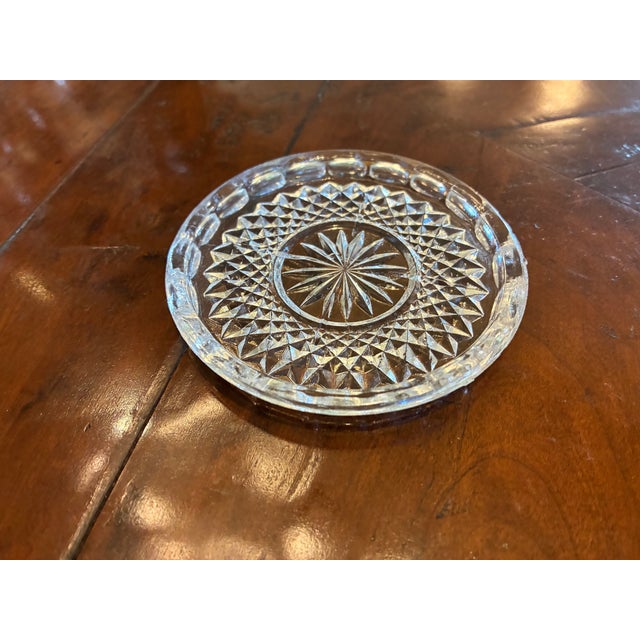 This is a set of small crystal coasters. The designs are not cut but molded and pretty nonetheless. Small raised edges in...