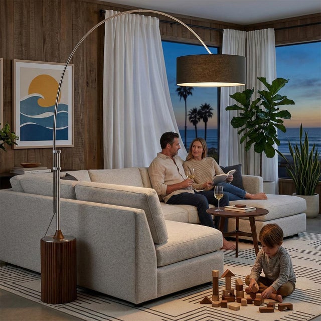 The Tambo Arc Lamp is a Mid-Century Modern masterpiece designed by Peter Morelli in 1984, featuring a satin nickel frame...