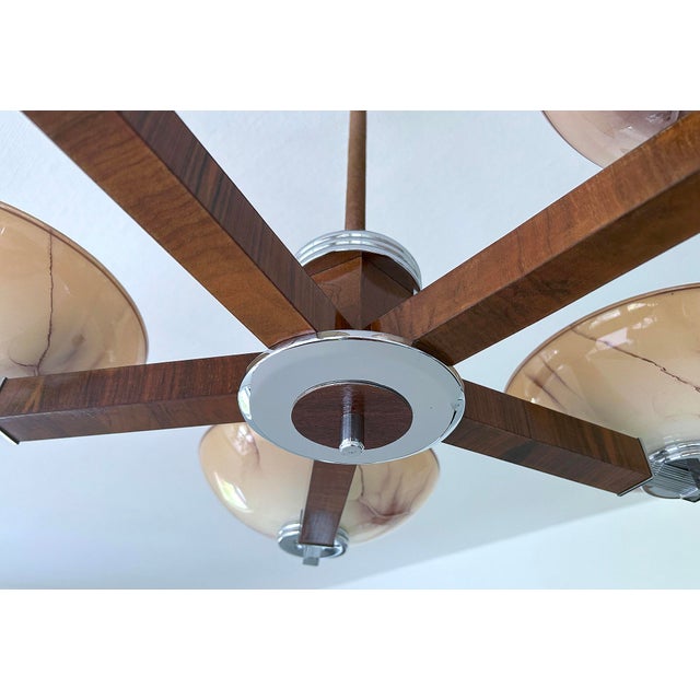 large Art Deco pendant light from the 1930s, fully rewired, featuring a wood structure with chrome trim, 5 spokes with...
