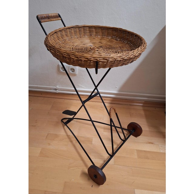 Vintage Tea Trolley with Newspaper Shelf in Black Iron Frame, Teak Wheels and Removable Wicker Tray, 1970s For Sale - Image 4 of 9